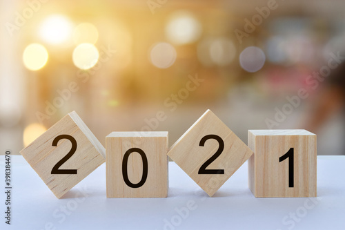 Geometric wood cubes on table with numbers 2021, Concept of new year 2021, copy space.