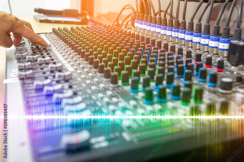 Fototapeta premium Sound recording studio mixing desk with engineer or music producer