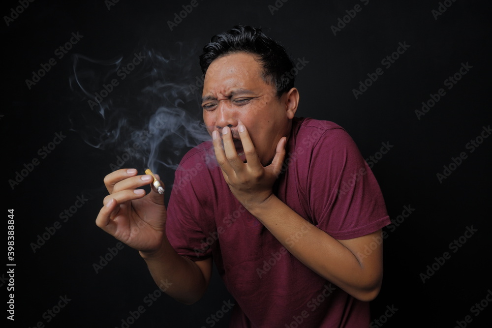 man smoking cigarette, funny asian guy smoking with fabulous face  expression, shocked smoker Stock Photo | Adobe Stock