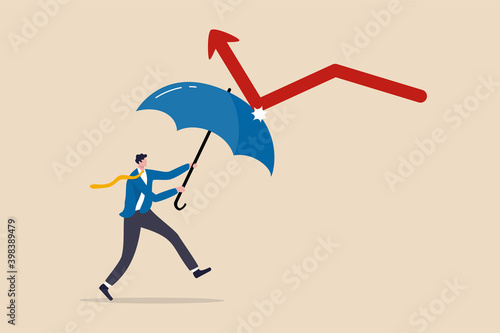 Economic recovery from COVID-19 crisis, business protection or stock market bounce back from recession concept, smart confidence businessman holding strong umbrella to recover red arrow economic graph
