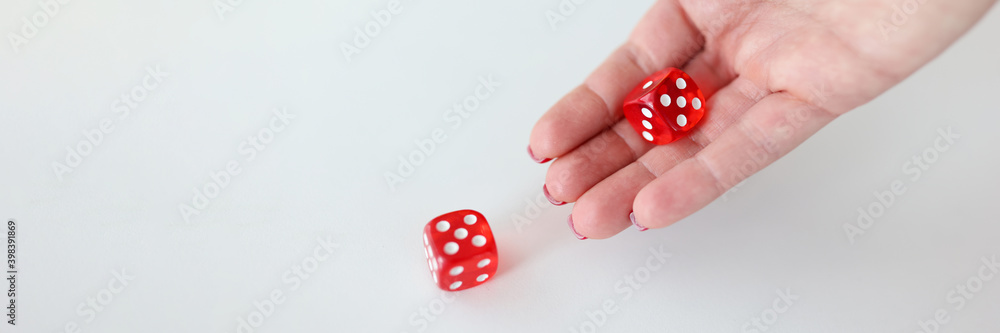 In hand are red cubes with numbers In hand are red cubes with numbers