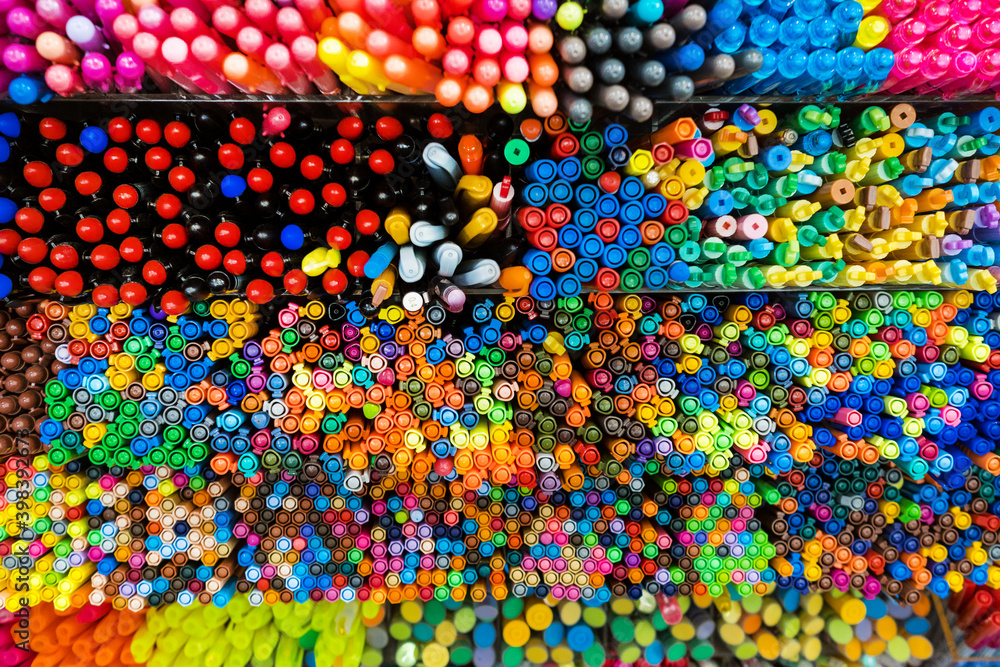 Fototapeta premium Top view of mixed colorful markers placed in the box. Pattern and texture. Background. Stationery.