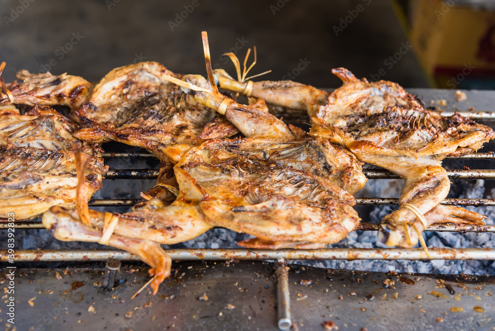 Grilled chicken the favorite food at roadside in Thailand. Grilled chicken the favorite food at roadside in Thailand.