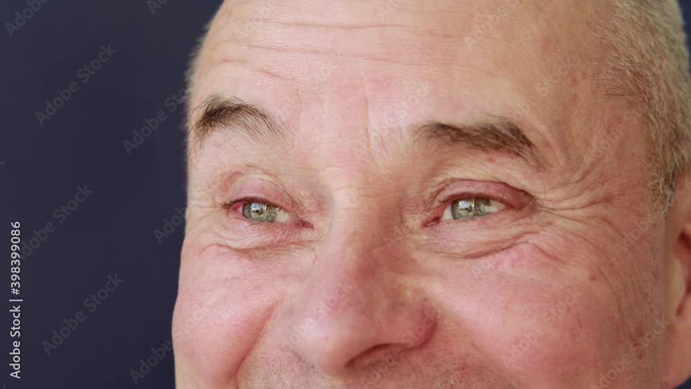 serious elderly man, face with wrinkles, green eyes close up, concept of human memory training, emotions, age problems serious elderly man, face with wrinkles, green eyes close up, concept of human memory training, emotions, age problems