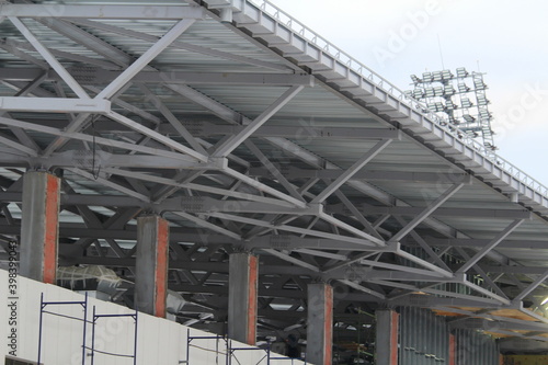 An old steel metal farm. structure of metal structure of frame-type industrial building. Lightweight metal frame construction.
