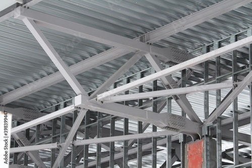 An old steel metal farm. structure of metal structure of frame-type industrial building. Lightweight metal frame construction.