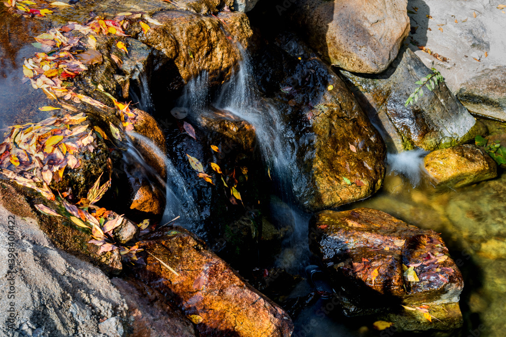 Fototapeta premium Closeup flowing water from small stream
