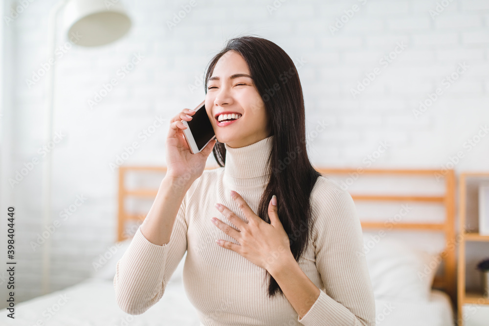 young woman talking with friend on mobile phone and laughing young woman talking with friend on mobile phone and laughing
