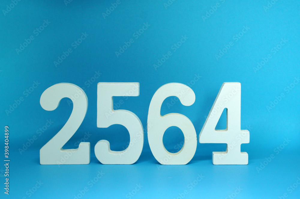 2564 number wooden object on Blue background and copy space - Happy new year 2564 , Chinese new year - Blue concept - Thai Year