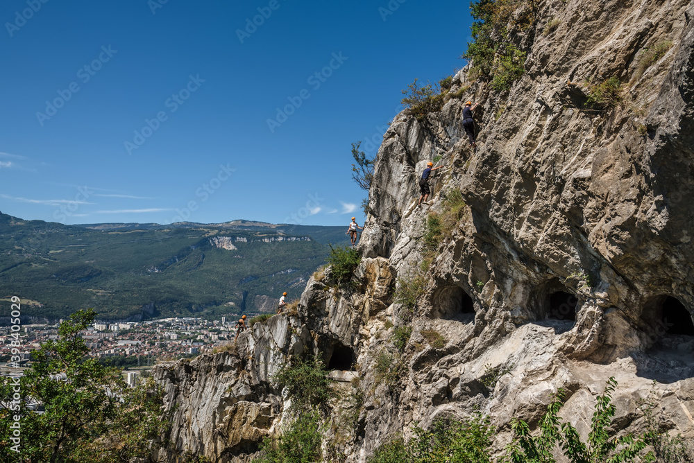 People Climbing Mountain by Mandrin Caves