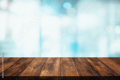 Wood table with blur interior kitchen or cafe for background.