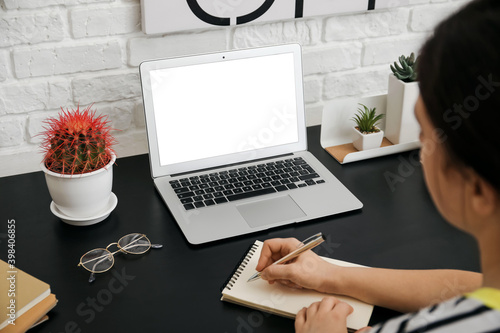 Girl studying at home. Concept of online education