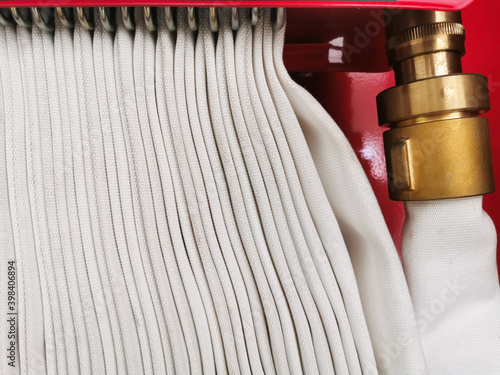 Fotografija Fire hose extinguisher nozzle background