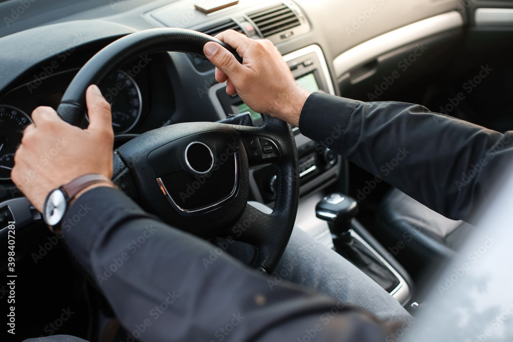 Handsome man driving modern car Handsome man driving modern car