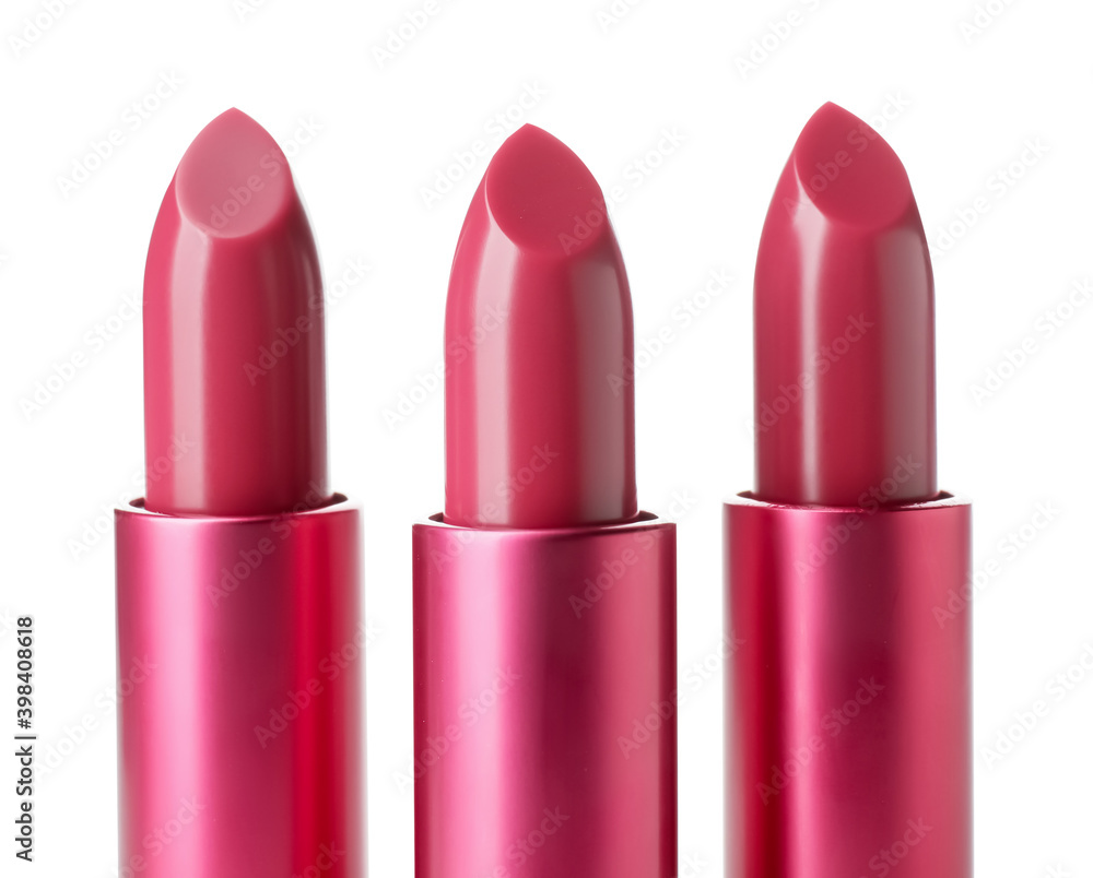 Fototapeta premium Beautiful lipsticks on white background
