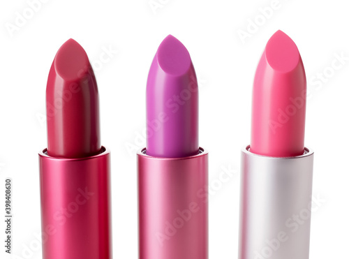 Different lipsticks on white background