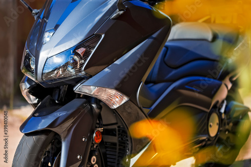 Closeup View of Modern Urban Motorcycle Headlights Outdoor.