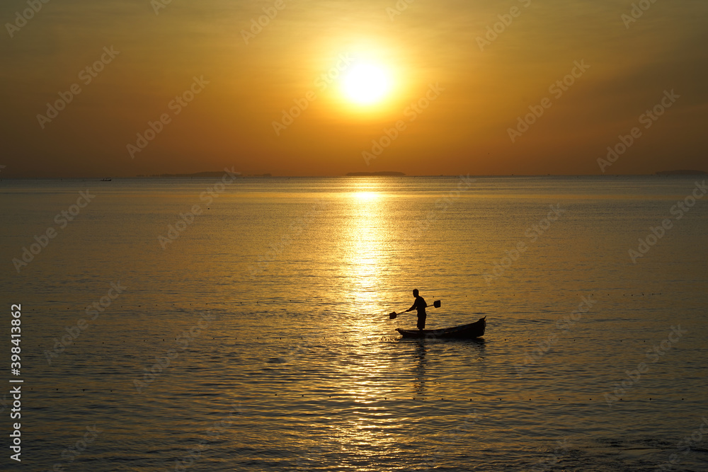 Fototapeta premium fishing boat at sunset