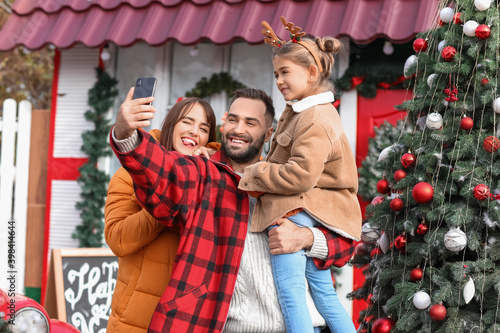Happy family taking selfie ...