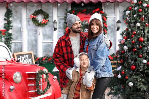 Happy family near house dec...