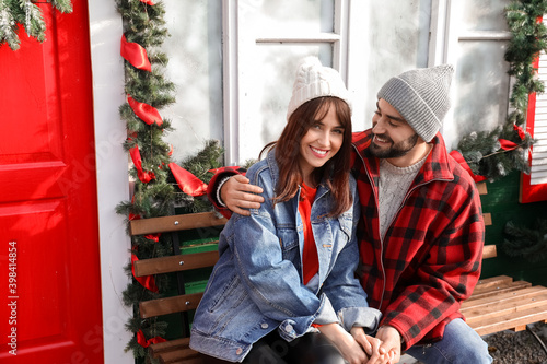 Happy couple near house dec...