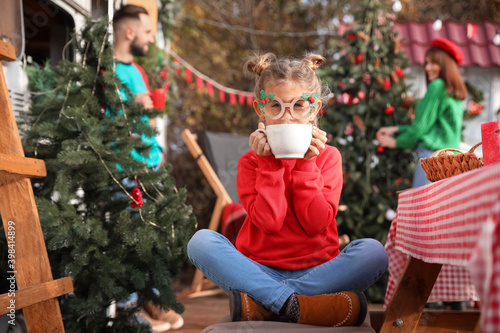 Happy little girl with cup ...