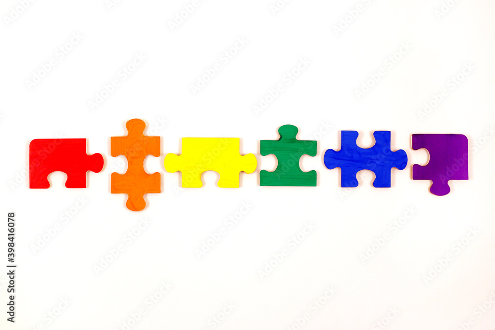 LGBT concept. Rainbow colored puzzle isolated on white background. Gay Pride. Concept of equality, acceptance of sexual minorities lesbian, gay, bisexual, transgender LGBT concept. Rainbow colored puzzle isolated on white background. Gay Pride. Concept of equality, acceptance of sexual minorities lesbian, gay, bisexual, transgender