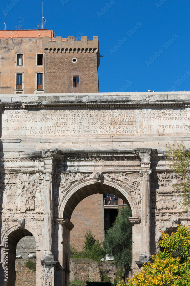 Forum Romanum, view of the ruins of several important ancient  buildings, fragment of Arch of Septimius Severus, Rome, Italy