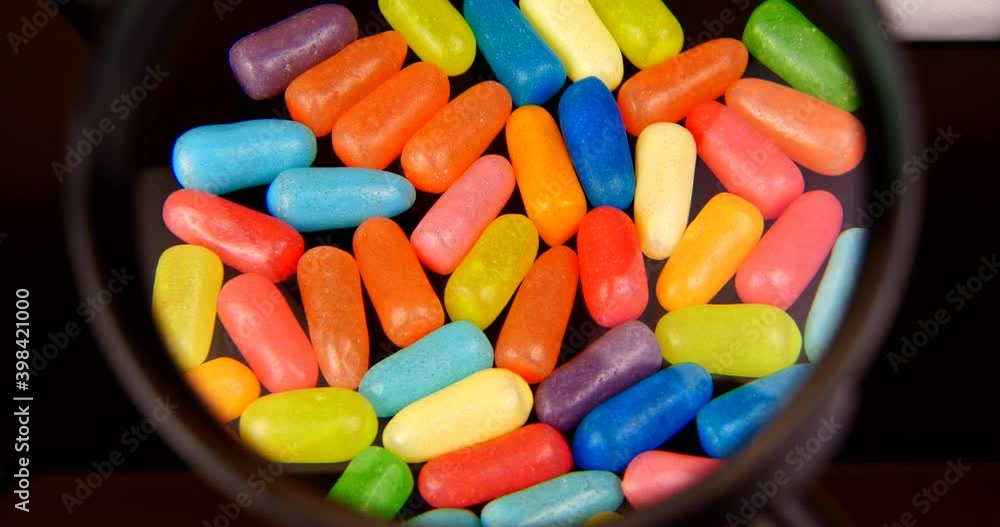 multicolored sweets candy close-up on a black background video 4k multicolored sweets candy close-up on a black background video 4k