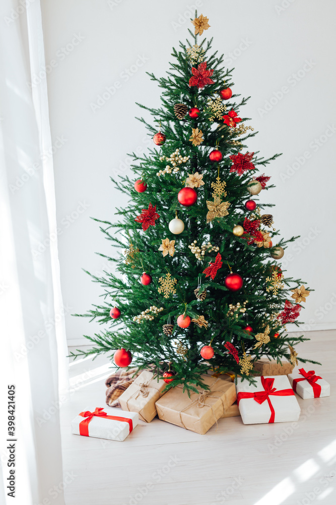 Christmas tree with new year gifts in the white room Christmas tree with new year gifts in the white room