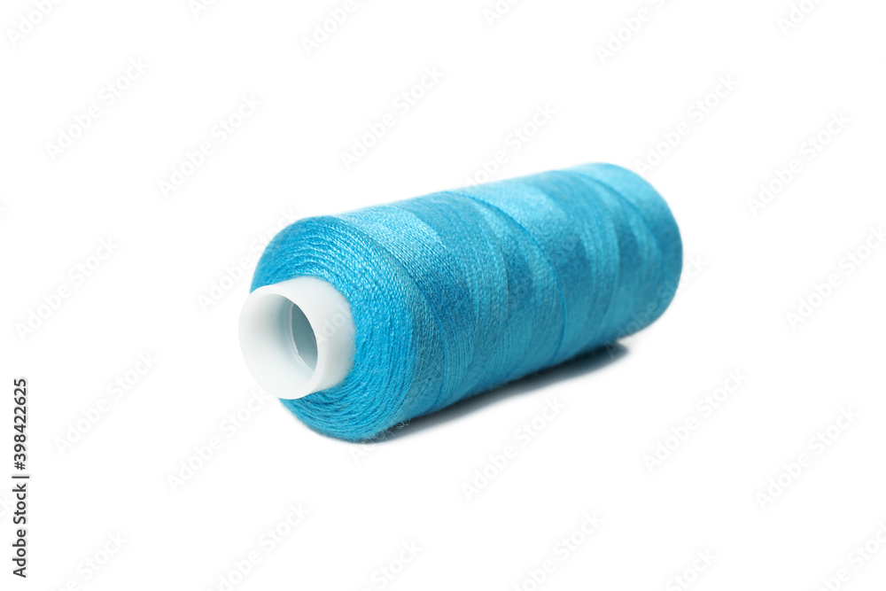 Blue spool of thread isolated on white background Blue spool of thread isolated on white background
