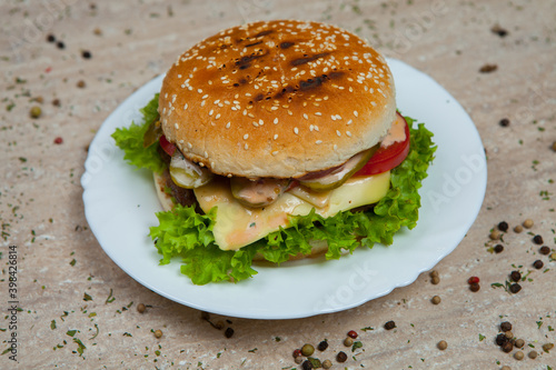 Fresh and juicy hamburger. Delicious cheese burger on a rustic wooden table