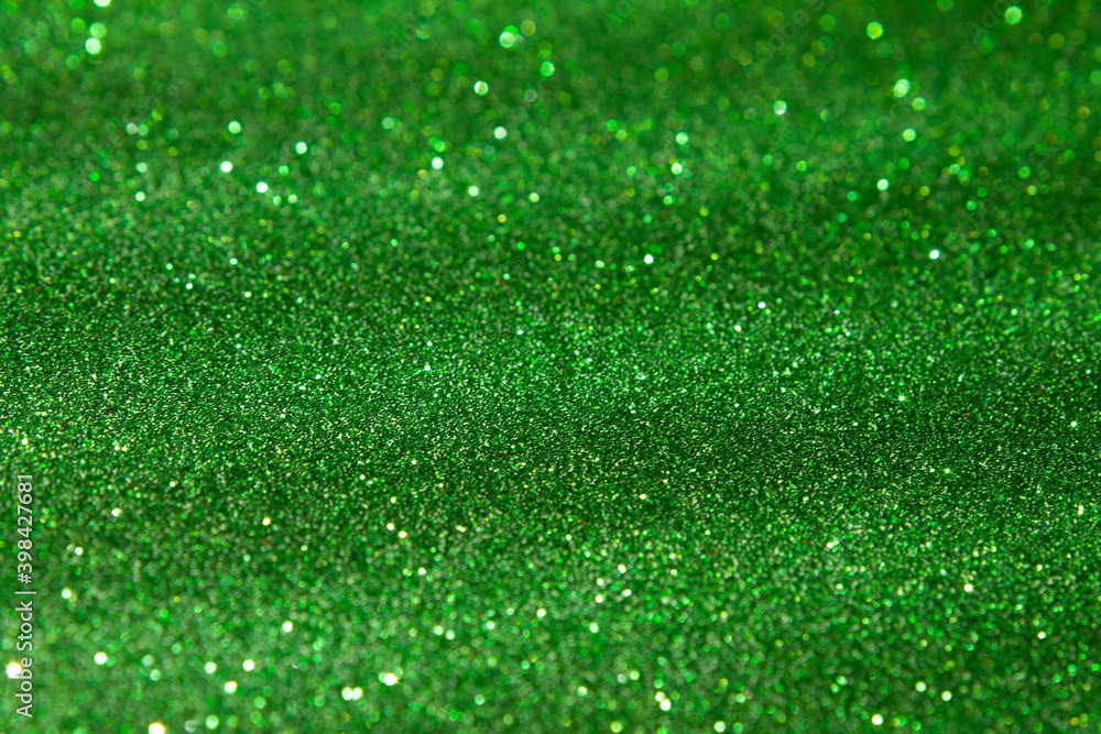 Naklejka premium green shiny glitter background