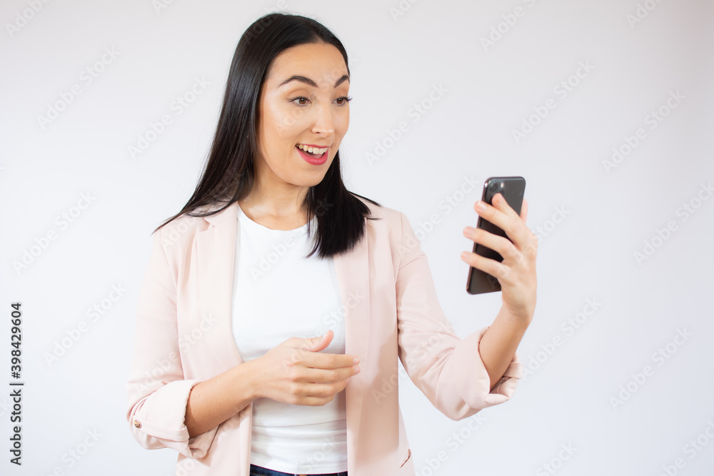 Portrait of a happy young business woman using mobile phone isolated over white background Portrait of a happy young business woman using mobile phone isolated over white background