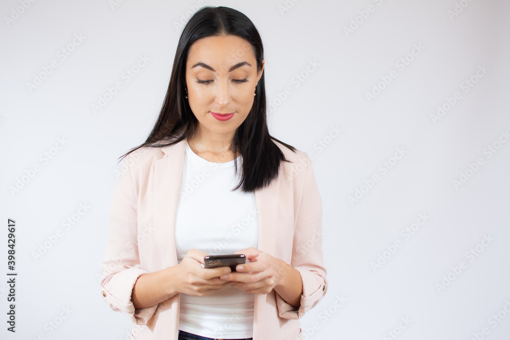 Portrait of a happy young business woman using mobile phone isolated over white background Portrait of a happy young business woman using mobile phone isolated over white background