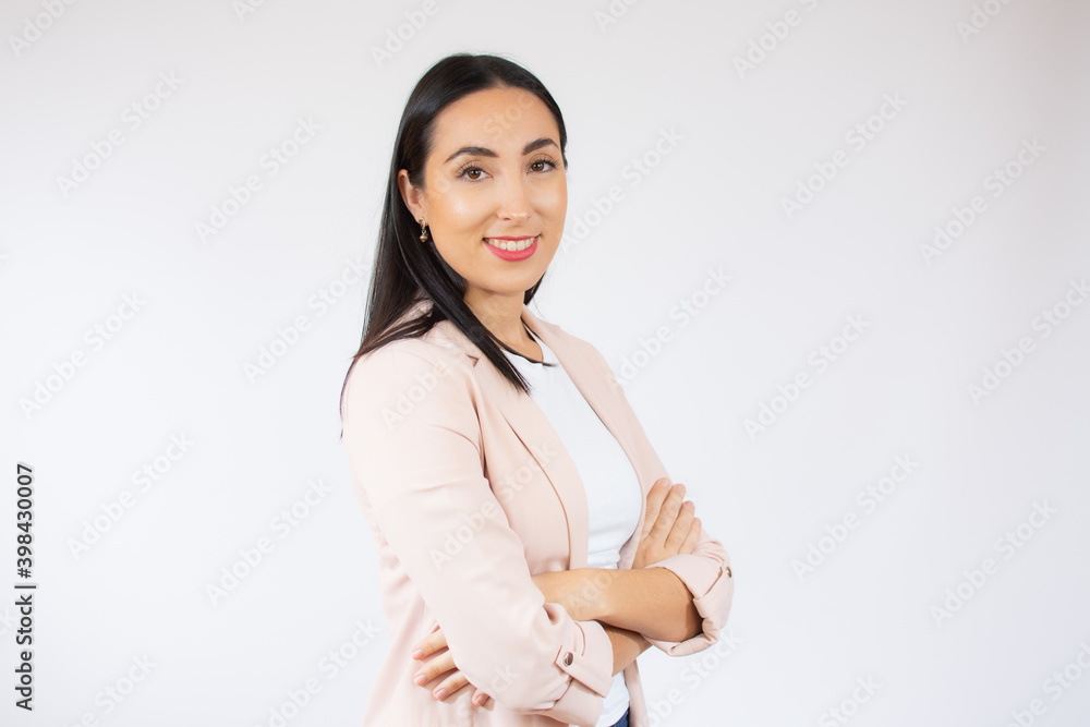 Portrait of a cheerful smiling business woman standing with arms folded isolated over white background Portrait of a cheerful smiling business woman standing with arms folded isolated over white background
