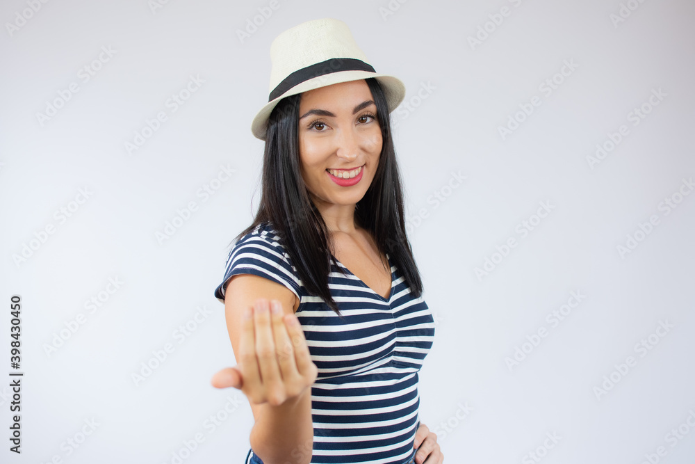 Young woman over isolated white background inviting to come with hand. Happy that you came Young woman over isolated white background inviting to come with hand. Happy that you came