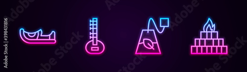 Set line Indian shoes, Sitar, Tea bag and Yagna. Glowing neon icon. Vector.