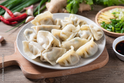 Close up fresh boiled dumplings. Chinese food on rustic old vintage wooden background photo