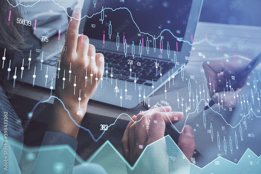 Double exposure of man and woman working together and forex chart hologram. Business concept. Computer background. Double exposure of man and woman working together and forex chart hologram. Business concept. Computer background.
