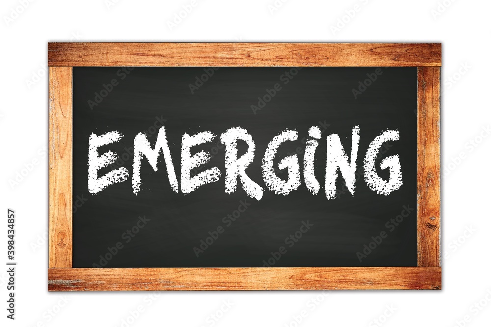 EMERGING text written on wooden frame school blackboard. EMERGING text written on wooden frame school blackboard.