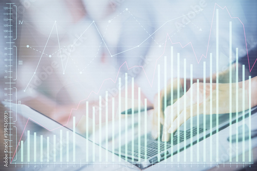 Double exposure of woman hands typing on computer and forex chart hologram drawing. Stock market invest concept. © peshkova
