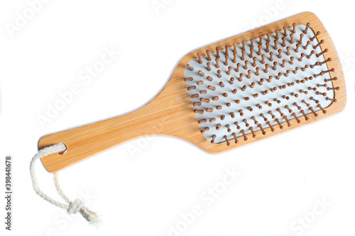 wooden hairbrush isolated on white background with copy space for your text