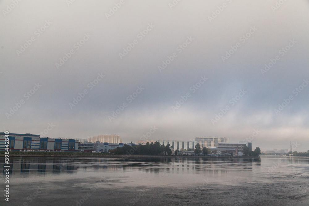 Foggy morning river cityscape of dormitory area of Saint Petersburg Foggy morning river cityscape of dormitory area of Saint Petersburg