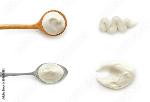 Set of tartar garlic sauce in spoons top view isolated on white background