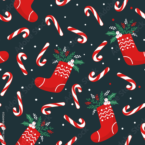 Seamless pattern for Christmas with socks, foliage, candy canes and berries. Repeat design for background, wrapping paper or fabric.