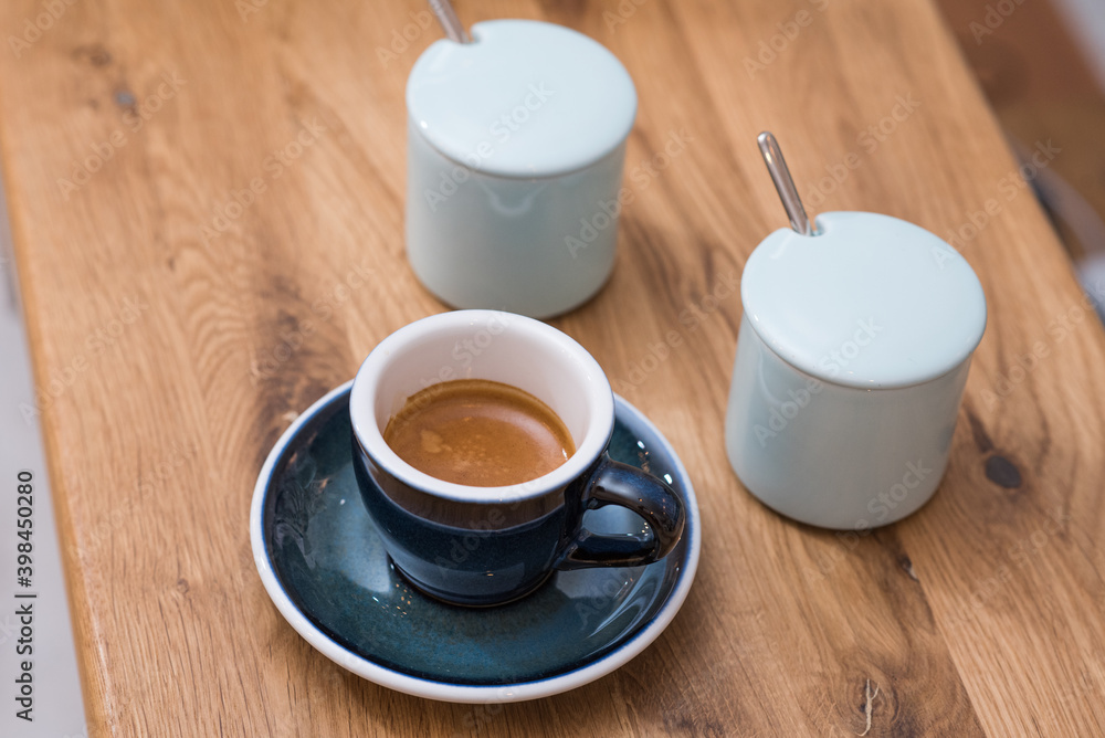 Delicious, aromatic and invigorating espresso coffee on the table in the cafeteria Delicious, aromatic and invigorating espresso coffee on the table in the cafeteria