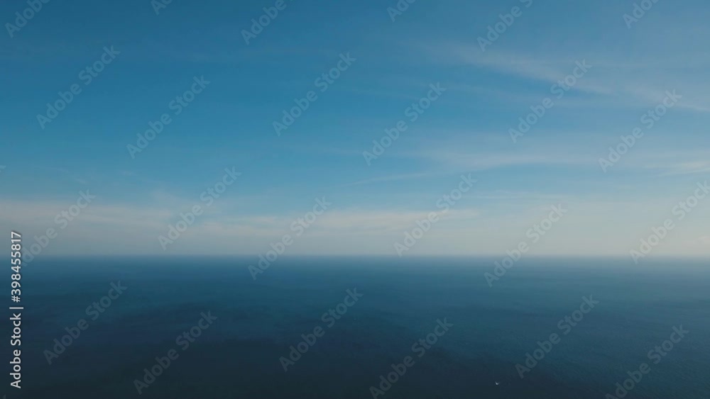 Aerial view: Sea water surface with waves. Flying over the blue ocean with blue water, sky, clouds. Bali,Indonesia.4K video. Travel concept. Aerial footage Aerial view: Sea water surface with waves. Flying over the blue ocean with blue water, sky, clouds. Bali,Indonesia.4K video. Travel concept. Aerial footage