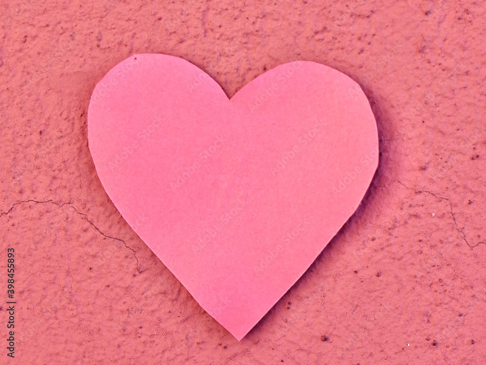 Valentine's day. Pink heart cut out of paper on a pink background. Wallpaper. Space for text Valentine's day. Pink heart cut out of paper on a pink background. Wallpaper. Space for text