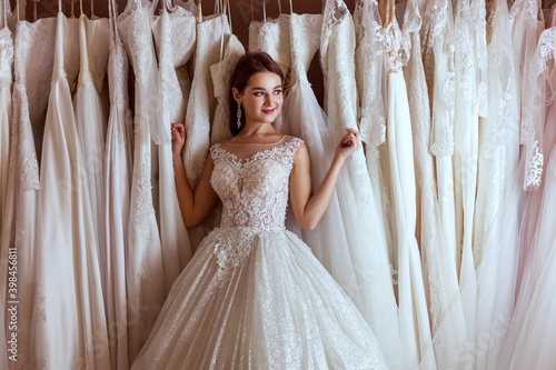 Portrait of a young bride in a luxurious wedding dress.